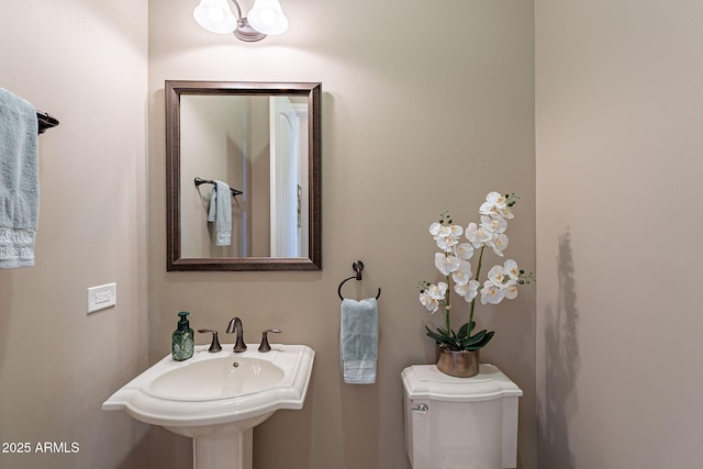 bathroom with toilet and sink