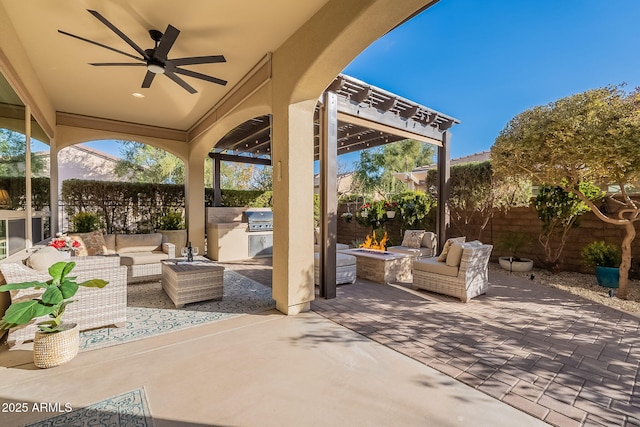 view of patio / terrace featuring exterior kitchen, a grill, an outdoor living space with a fire pit, and ceiling fan