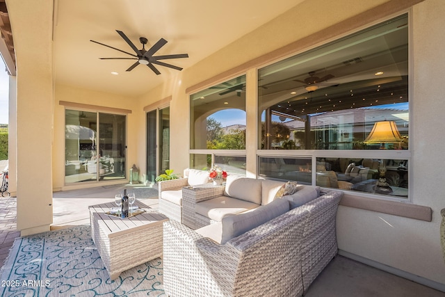 view of patio with outdoor lounge area and ceiling fan