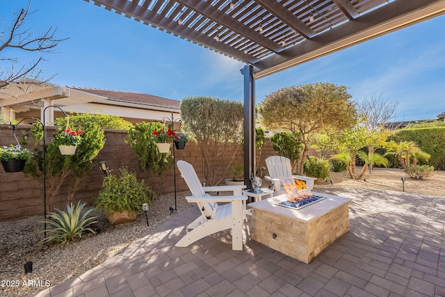 view of patio featuring an outdoor fire pit and a pergola