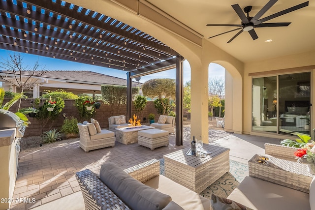 view of patio / terrace with an outdoor living space with a fire pit, ceiling fan, and a pergola