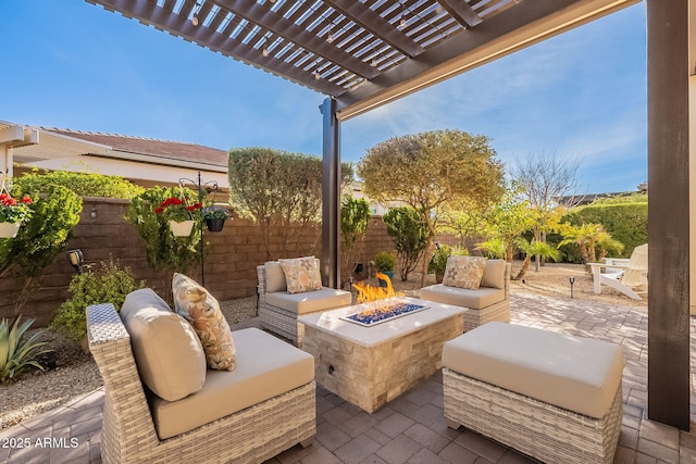 view of patio / terrace with a pergola and an outdoor living space with a fire pit