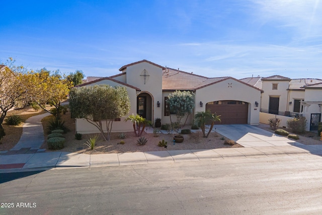 mediterranean / spanish house featuring a garage