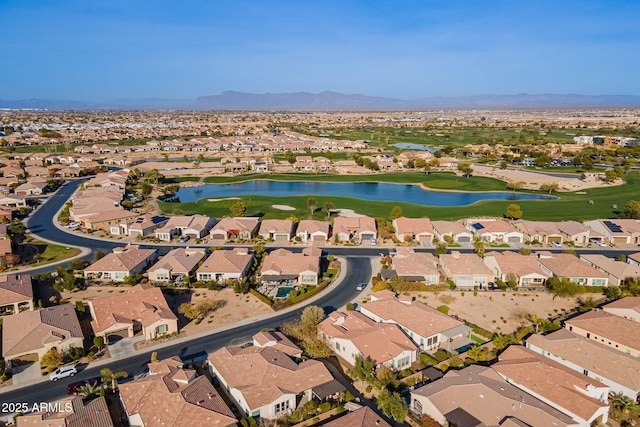 drone / aerial view featuring a water and mountain view