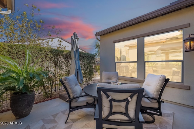 view of patio terrace at dusk