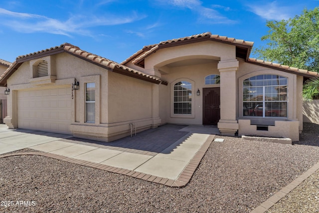 1245 W Cindy St, Chandler, AZ 85224 - mediterranean / spanish-style house featuring a garage, stucco siding, concrete driveway, and a tile roof
