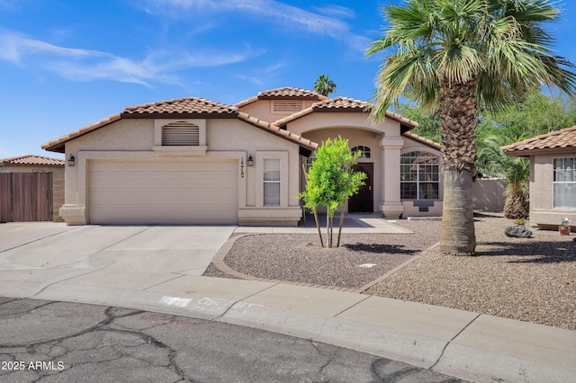 1245 W Cindy St, Chandler, AZ 85224 - mediterranean / spanish house with stucco siding, concrete driveway, a garage, and a tile roof
