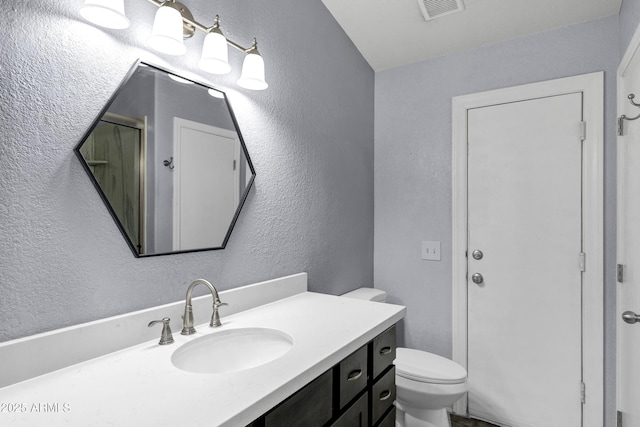 1245 W Cindy St, Chandler, AZ 85224 - bathroom featuring a textured wall, vanity, and toilet