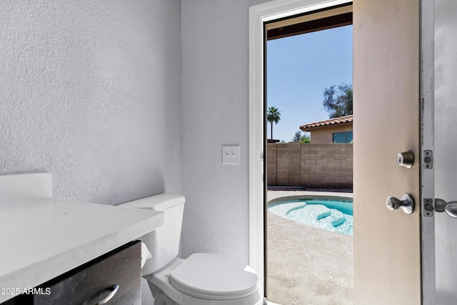 1245 W Cindy St, Chandler, AZ 85224 - bathroom with a textured wall, toilet, and vanity