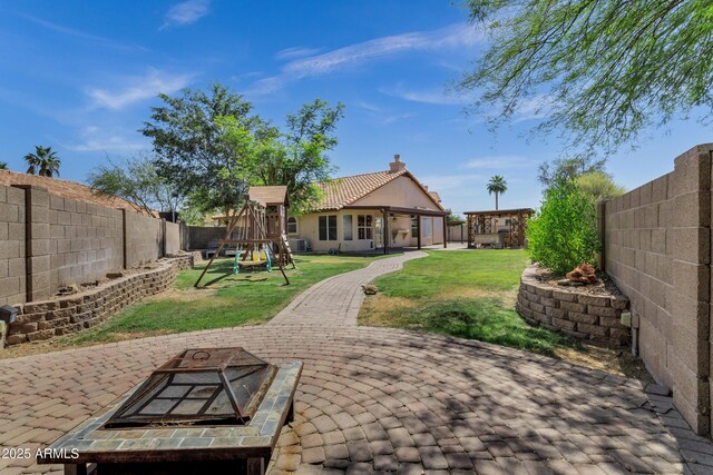 1245 W Cindy St, Chandler, AZ 85224 - view of yard featuring a playground, a patio area, and a fire pit