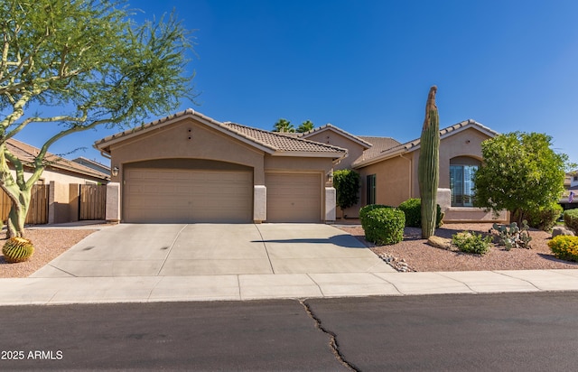4241 E Andre Ave, Gilbert, AZ 85298 - mediterranean / spanish-style house featuring stucco siding, a garage, concrete driveway, and a tile roof