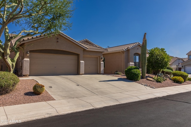 4241 E Andre Ave, Gilbert, AZ 85298 - mediterranean / spanish home with stucco siding, an attached garage, concrete driveway, and a tile roof