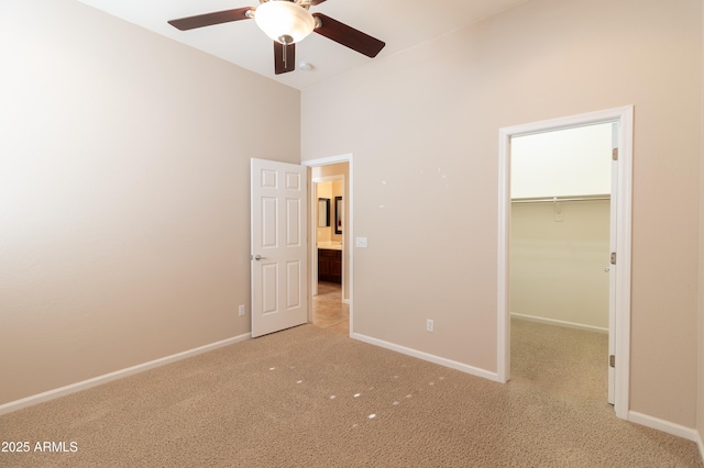 4241 E Andre Ave, Gilbert, AZ 85298 - unfurnished bedroom with light colored carpet, a walk in closet, a closet, and ceiling fan