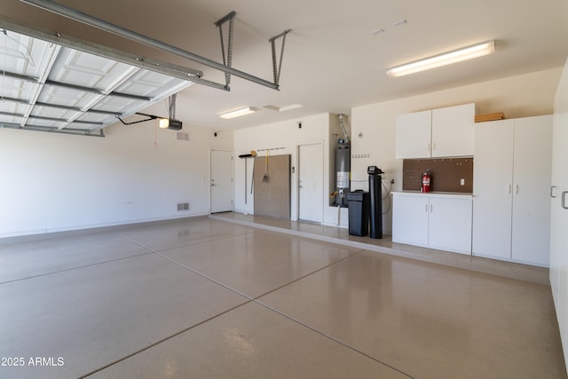 4241 E Andre Ave, Gilbert, AZ 85298 - garage featuring a garage door opener and water heater