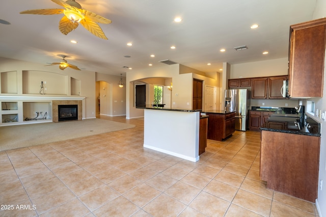 4241 E Andre Ave, Gilbert, AZ 85298 - kitchen featuring appliances with stainless steel finishes, a ceiling fan, light tile patterned flooring, arched walkways, and recessed lighting