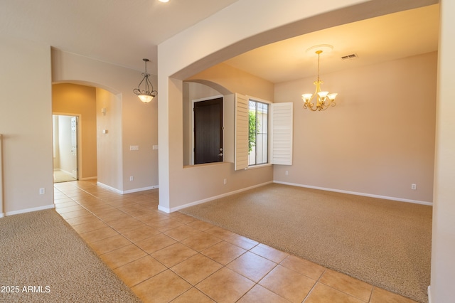 4241 E Andre Ave, Gilbert, AZ 85298 - empty room with light carpet, light tile patterned flooring, arched walkways, and a chandelier