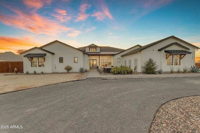 35150 N Bell Rd, Queen Creek, AZ 85144 - view of front of house with a standing seam roof, fence, and metal roof