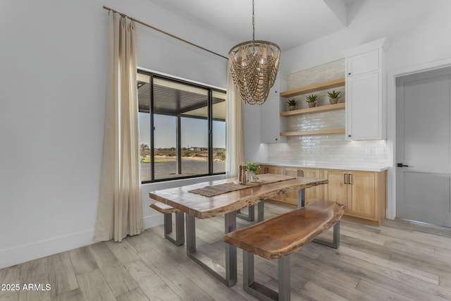 35150 N Bell Rd, Queen Creek, AZ 85144 - dining space featuring light wood-style flooring, baseboards, and a chandelier