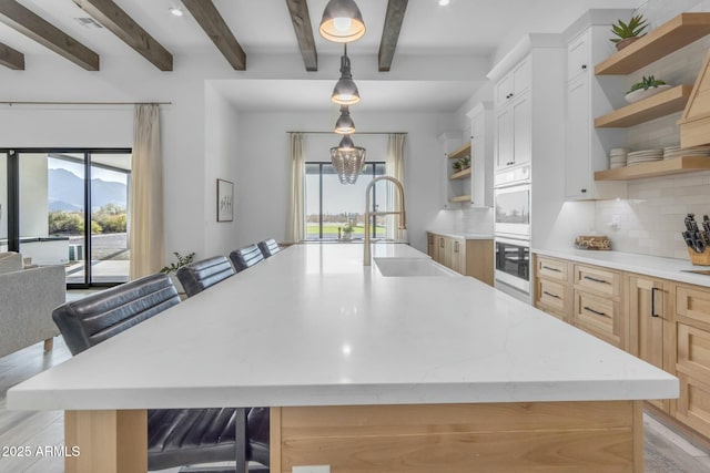 35150 N Bell Rd, Queen Creek, AZ 85144 - kitchen featuring tasteful backsplash, a sink, a wealth of natural light, and open shelves