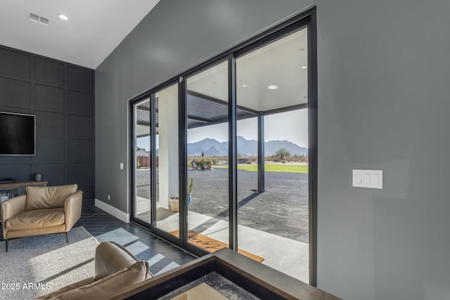 35150 N Bell Rd, Queen Creek, AZ 85144 - doorway to outside with visible vents, baseboards, a wall of windows, recessed lighting, and a mountain view