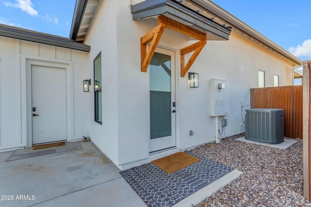 35150 N Bell Rd, Queen Creek, AZ 85144 - view of exterior entry featuring central AC unit, fence, and stucco siding
