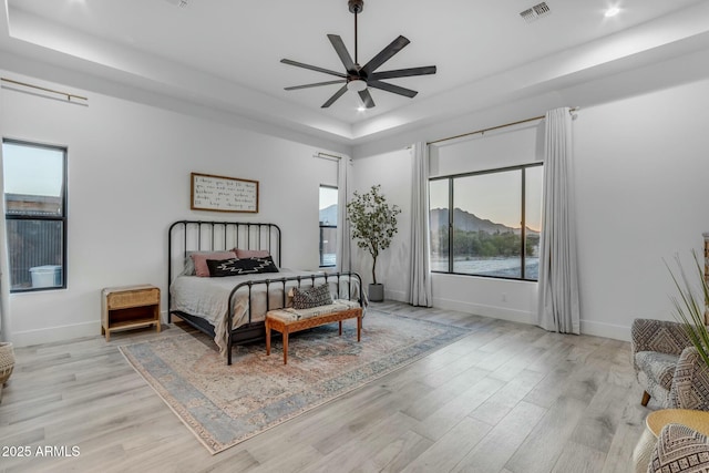 35150 N Bell Rd, Queen Creek, AZ 85144 - bedroom featuring visible vents, baseboards, recessed lighting, light wood-style flooring, and a raised ceiling