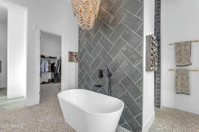 35150 N Bell Rd, Queen Creek, AZ 85144 - full bath with a spacious closet, tile patterned floors, and a freestanding tub