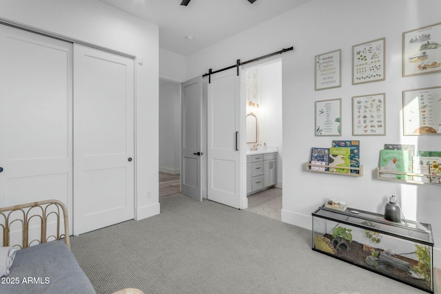 35150 N Bell Rd, Queen Creek, AZ 85144 - bedroom with baseboards, a barn door, light carpet, a closet, and ensuite bath