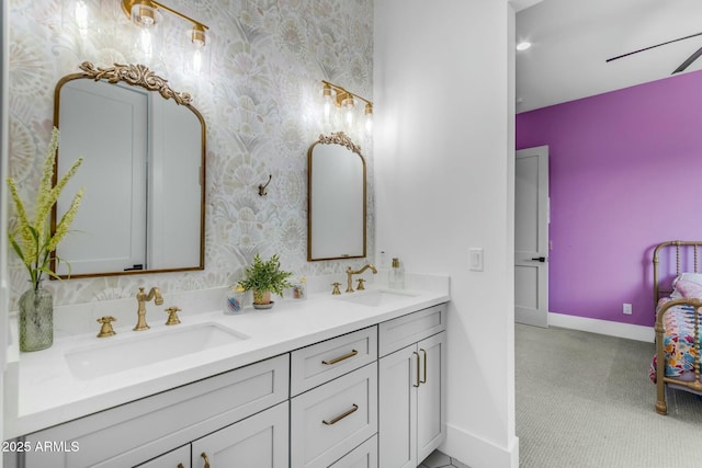 35150 N Bell Rd, Queen Creek, AZ 85144 - bathroom with double vanity, wallpapered walls, baseboards, and a sink