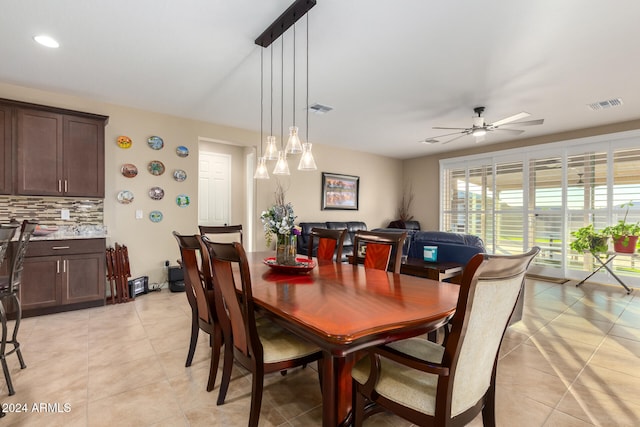 tiled dining room with ceiling fan