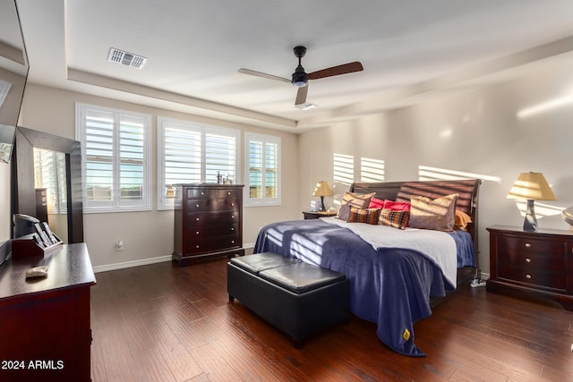 bedroom featuring ceiling fan and dark wood-type flooring