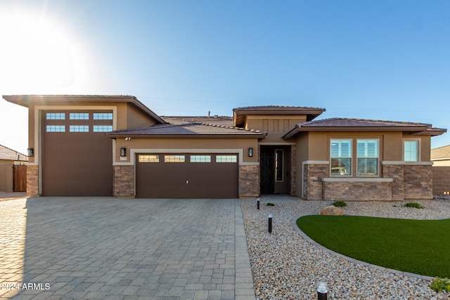 prairie-style home featuring a garage