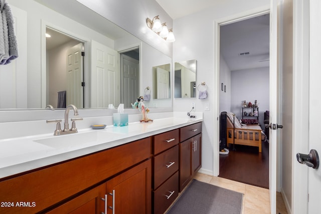 bathroom with tile patterned floors and vanity