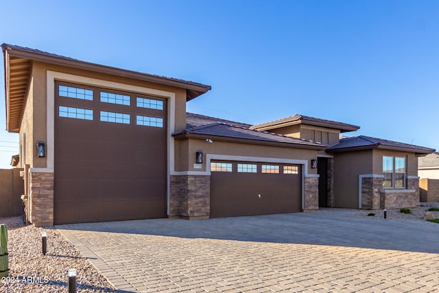 prairie-style home with a garage