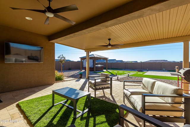 view of patio with a gazebo, an outdoor hangout area, and ceiling fan