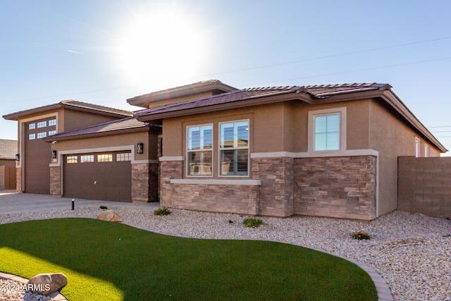 prairie-style house featuring a garage