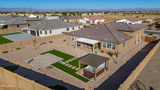 birds eye view of property featuring a mountain view