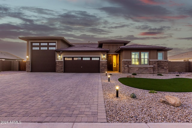 prairie-style house featuring a garage