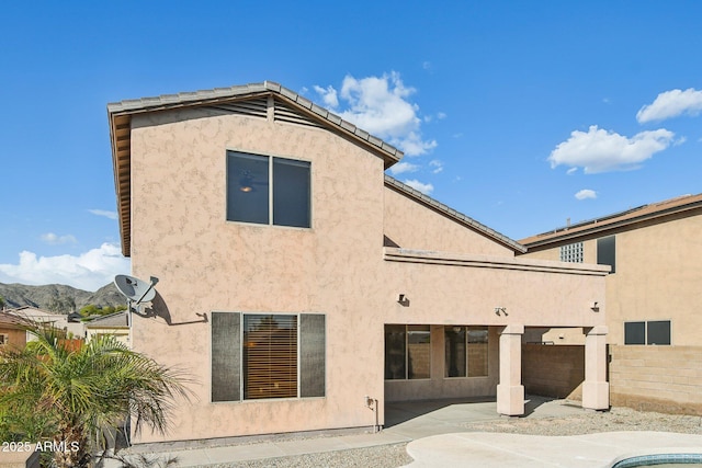 1801 W Nighthawk Way, Phoenix, AZ 85045 - back of house featuring a patio, stucco siding, and a mountain view
