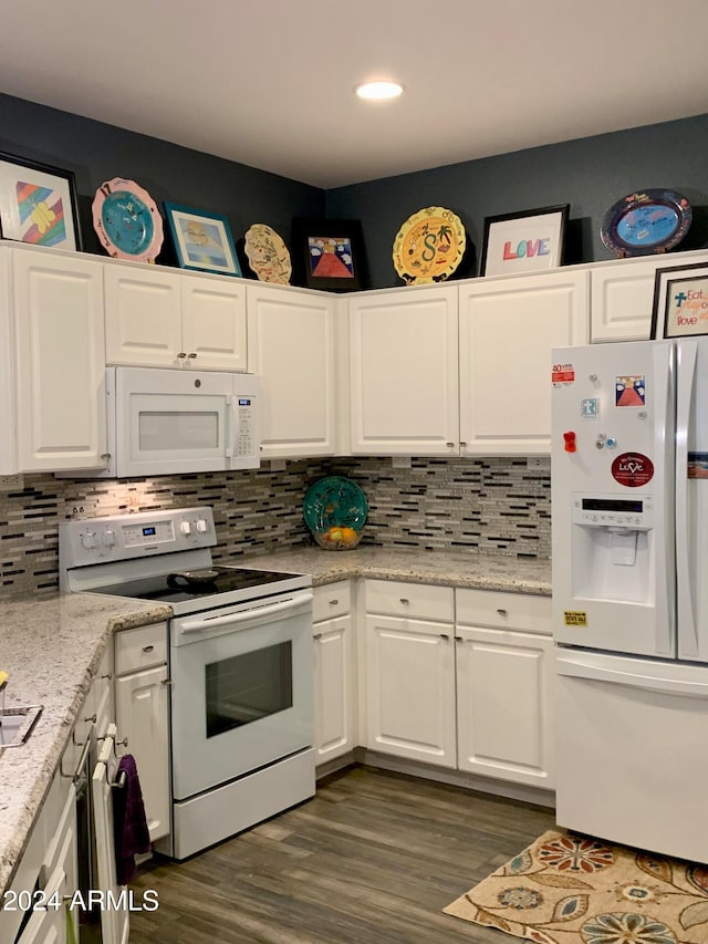 kitchen with white cabinets, white appliances, dark wood-type flooring, and tasteful backsplash