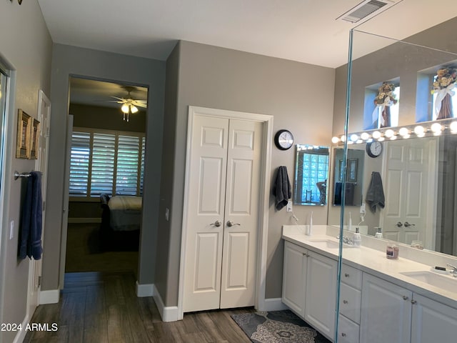 bathroom featuring ceiling fan, vanity, and wood-type flooring