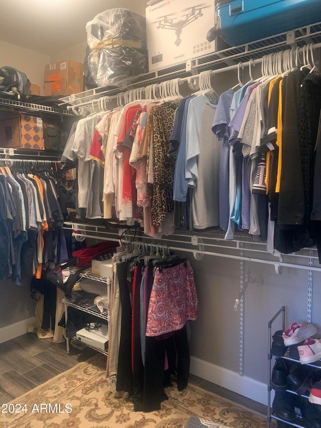 walk in closet featuring hardwood / wood-style flooring