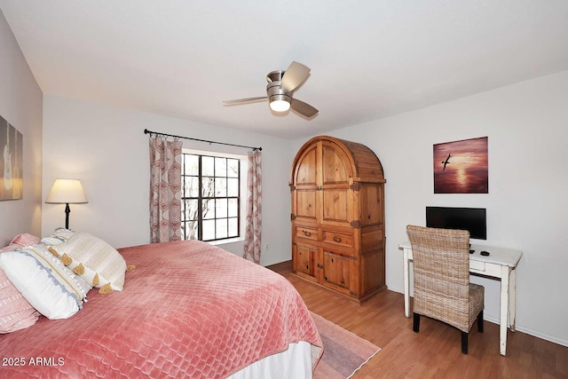 bedroom featuring light wood-type flooring and ceiling fan