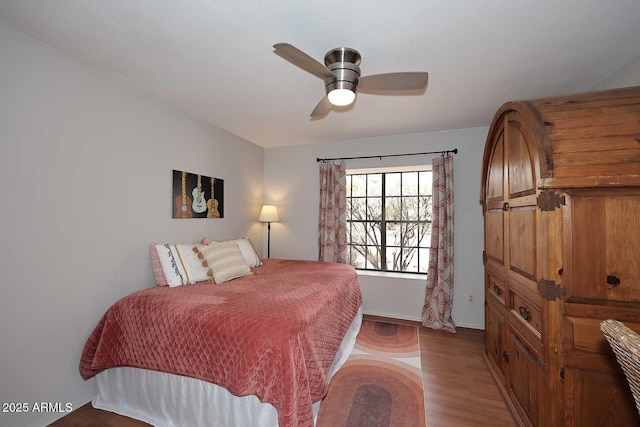 bedroom featuring wood finished floors and ceiling fan