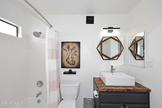 bathroom with shower / bath combination with curtain, toilet, and vanity