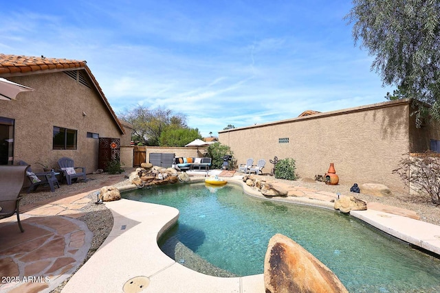 view of pool with a patio area, a fenced in pool, and a fenced backyard