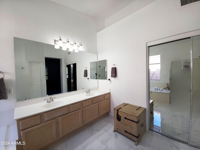 bathroom with independent shower and bath and vanity