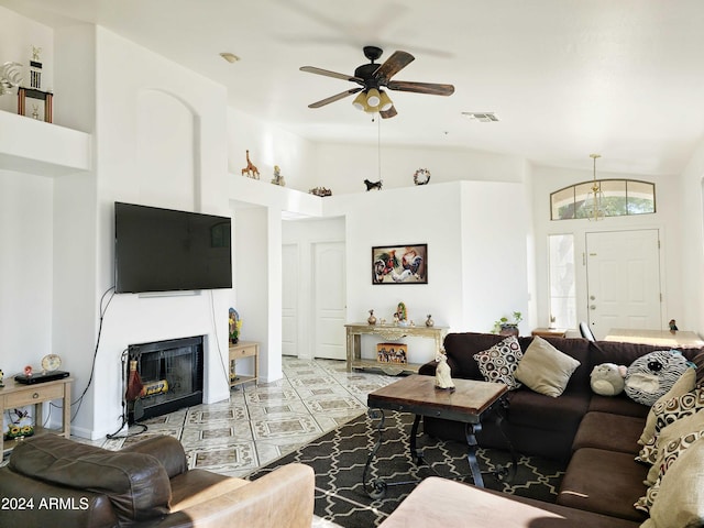 living room featuring ceiling fan, tile patterned flooring, and high vaulted ceiling