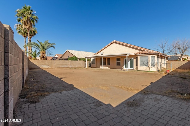 rear view of house featuring a patio area