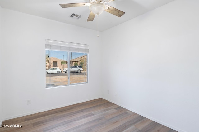 11669 N 165th Ave, Surprise, AZ 85388 - spare room with ceiling fan, visible vents, baseboards, and wood finished floors